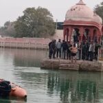 He took his 7 year old son in his lap and pushed him into the pond, then jumped in himself, both died