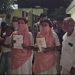 The villagers are afraid to attend the wedding due to the Panchayat's decree; the bride and groom go to the police station, demanding action.